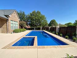 Aquamarine design builder swimming pool Central Austin, Texas 78705. Install contractor inground fiberglass pools Copper Crest, Tx. with special prices.