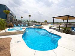 AquaPools tanning ledge fiberglass pools custom install Anna 75409. Best affordable contractor inground pool builder 75446 with best prices.