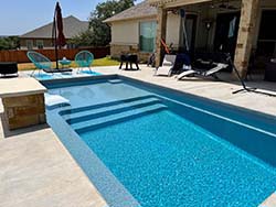 Design build contractor fiberglass swimming pool Oakland Estates, Texas. Install companies Aquamarine inground pools Palm Heights, Tx. 78225.
